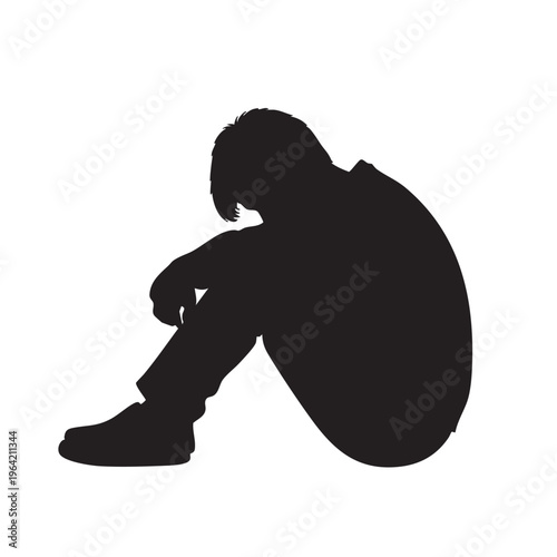Silhouette of a sad person sitting alone representing loneliness and depression isolated on a white background