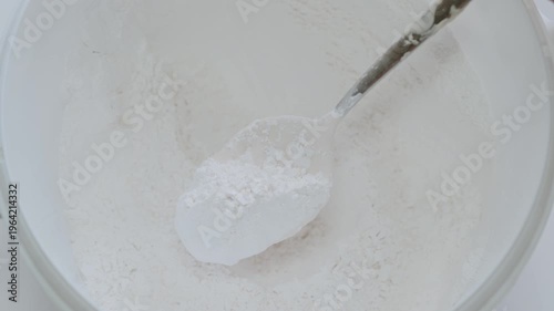 White All-Purpose Flour In Bowl With Measuring Scoop For Baking And Cooking Preparation