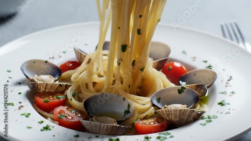 Close-Up of Spaghetti With Clams and Cherry Tomatoes Being Twirled on a Fork