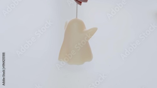 Handheld White Ghost Candle Hanging by Wick Minimal Halloween Decoration and Seasonal Party Prop