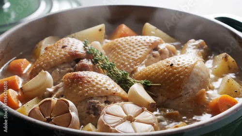 Close-Up of Chicken Stew Simmering in a Pot With Potatoes, Carrots, and Garlic