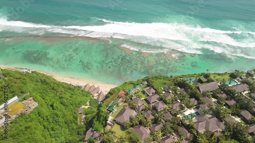 4K drone footage of Uluwatu, Bali: dramatic cliffs, crashing waves and turquoise ocean under bright daylight. Perfect for travel, nature, adventure and tropical destination projects