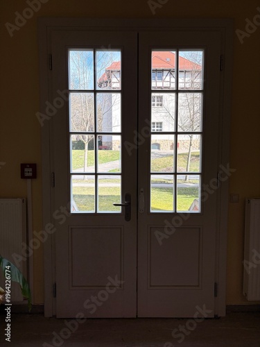 Looking through a window at historical city buildings, charming architecture, heritage structures, urban panorama, travel and culture concept