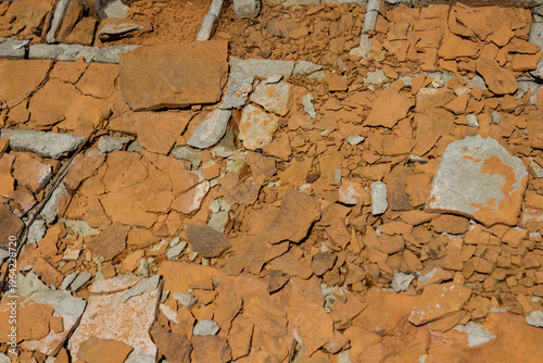 Crushed fired bricks are scattered. Flat lay.