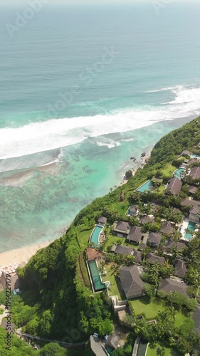 4K drone footage of Uluwatu, Bali: dramatic cliffs, crashing waves and turquoise ocean under bright daylight. Perfect for travel, nature, adventure and tropical destination projects