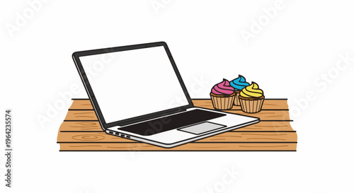 Laptop with colorful cupcakes on a wooden table