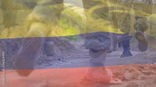 Animation of red shapes over flag of columbia over soldiers
