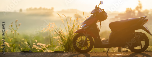 Εκτύπωση καμβά A scooter on an empty road in the morning fog, a symbol of freedom, solo travel, and a slow pace of life in a rural landscape at dawn
