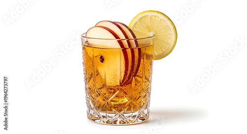 Glass of whiskey with apple slice.