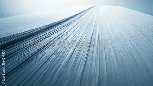 Abstract blue paper texture with fine linear details and soft color transitions under studio lighting