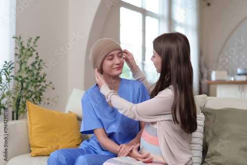 Female patients after receiving chemotherapy receive encouragement and care from family members or close friends.