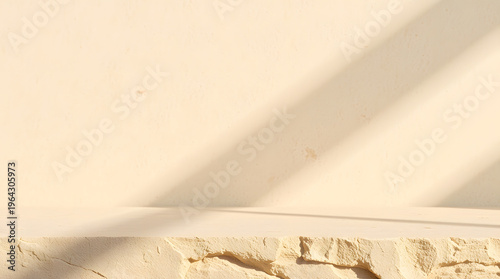 Minimalist background with natural sunlight and architectural shadows creating a serene aesthetic on a textured beige wall and rough-edged stone slab, ideal for modern product display