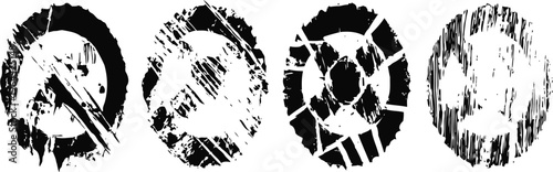 Set of four black and white worn and scratched circular grunge textures for design and background use