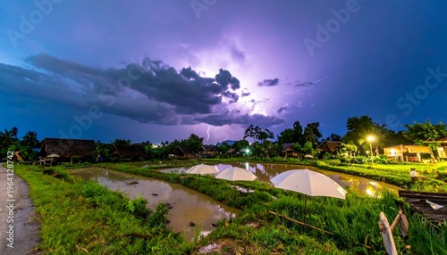 Dramatic Lightning Storm Over Rural Landscape at Night.