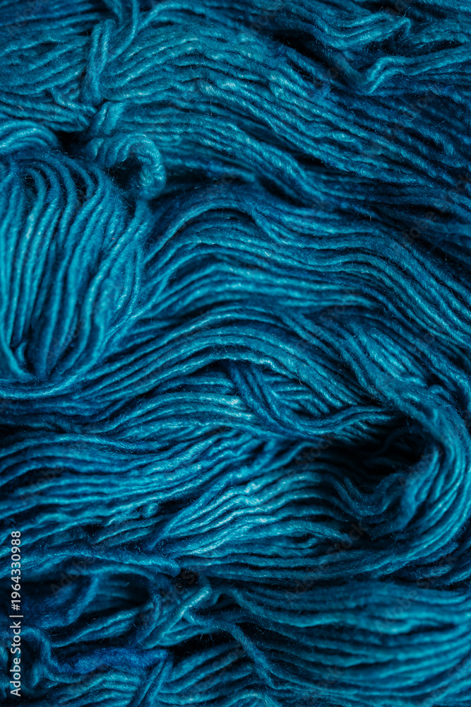 Fototapeta premium Detailed close-up of dark teal wool yarn texture, messy and soft fibers, rich abstract background for handmade and cozy design concepts