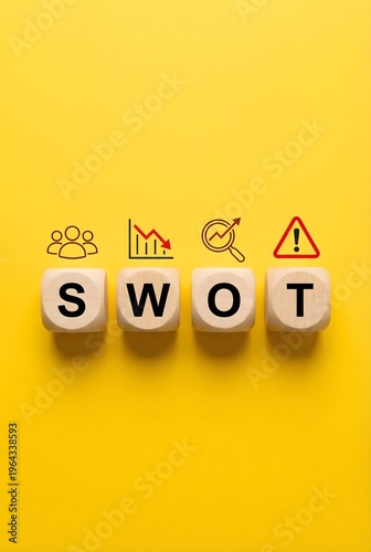 Wooden blocks spelling out swot analysis with related icons placed above on yellow background
