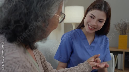 Caregiver elderly care home nurse support healthcare compassion assistance senior scene with young professional holding hand, gentle smile offering comfort in cozy living room, guidance, wellness