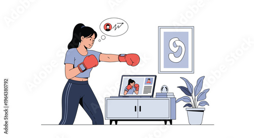 Determined woman practices boxing at home while following a virtual training session on her laptop during a fitness workout routine.