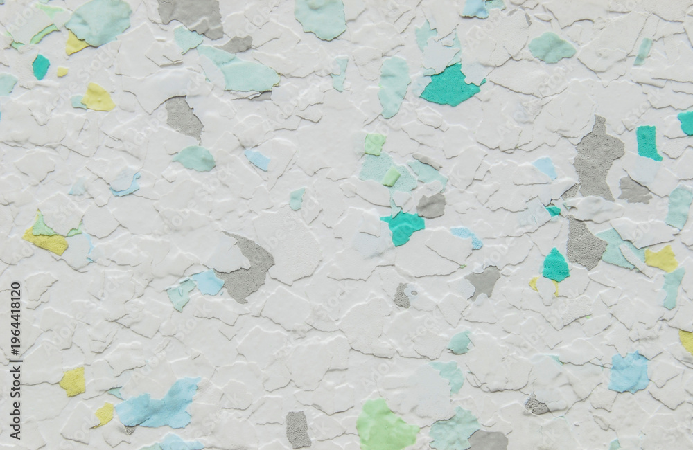 Fototapeta premium White pastel multicolor decorative flakes wall texture or pattern as background