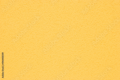 Vászonkép Yellow plastered dry wall texture, rough chips dry wall texture as background