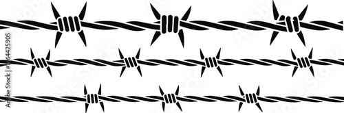 Barbed wire on farm boundary fence