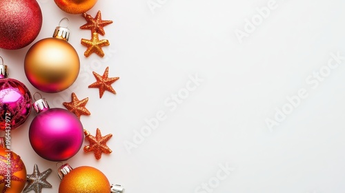 Vibrant Christmas Ornaments and Star Decorations Arranged on a Clean White Surface Ready for the Holiday Season