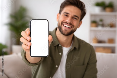 Happy Man Showing Mobile Phone with Empty Display, Copy Space for App Design, Lifestyle Portrait, Soft Natural Light