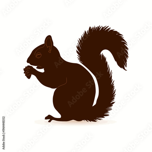 Brown squirrel silhouette eating nuts.