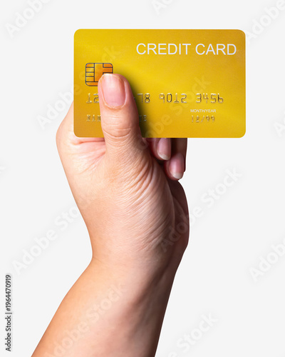 A close-up woman hand holds a gold credit card isolated on white background with a clipping path.