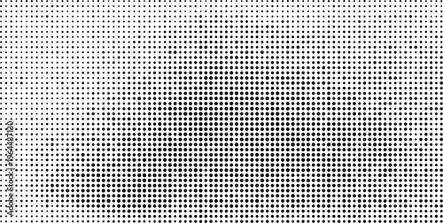 A dense monochromatic pattern of closely packed black dots on a white background