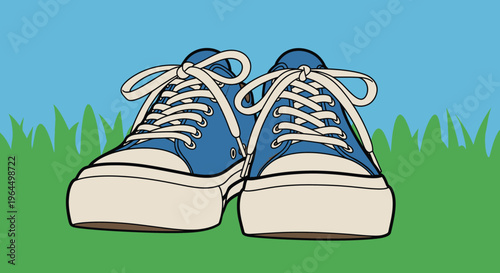 Casual blue canvas sneakers resting on green grass outdoors, relaxed summer footwear