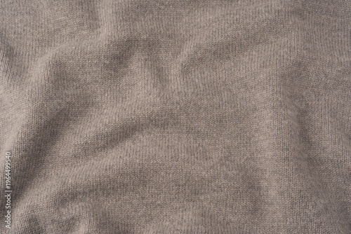 Soft grey merino wool sweater texture as a background.