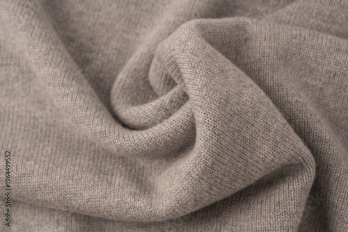 Soft grey merino wool sweater texture as a background.