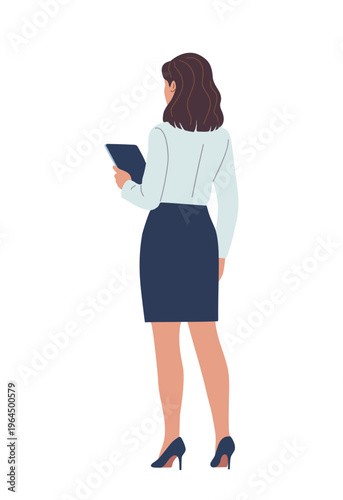 Woman stands facing away, holding tablet. She wears business attire, dark heels. Her posture suggests focus or preparation. Ideal for meetings, presentations, or remote work scenes