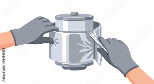 Gloved hands meticulously wrap a small, silver cylindrical object with decorative silver foil against a plain white background.