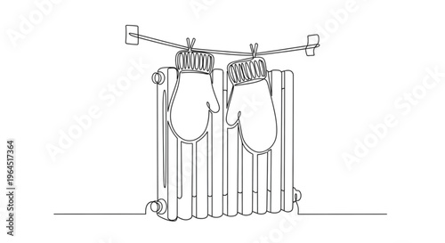 Knitted mittens drying on a radiator during winter season  