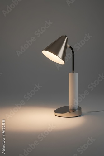 Modern desk lamp shines light on a smooth surface in a plain setting