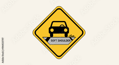 A yellow diamond road sign displays a black car over a "Soft Shoulder" message