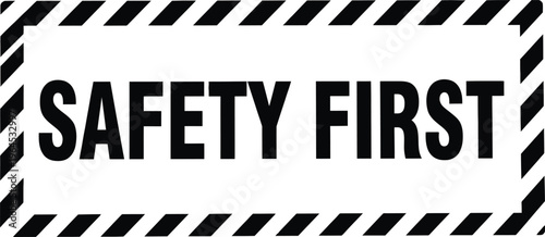 Safety first warning sign with black diagonal stripes on yellow background