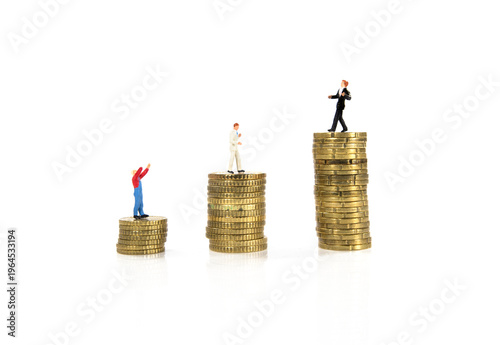 Business People Standing on Stacks of Coins Representing Income, Success and Financial Growth