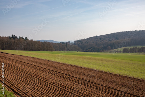 Landscape with freshly plowed agricultural field