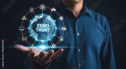 A traditional decorated pole with a red cloth and pot on top stands upright in a festive setting with green leaves