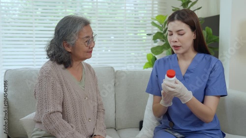 Caregiver elderly care at home nurse healthcare medication consultation and support in living room, calm caregiver guiding elderly patient on pill use with glove, compassion and trust during visit