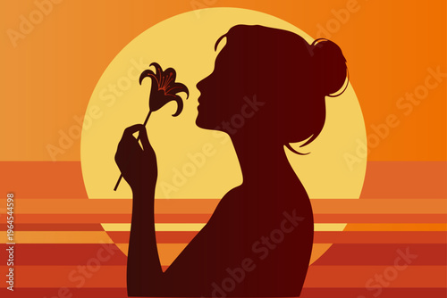 Silhouette of a girl with a flower in her hands against the background of a bright sunset.
