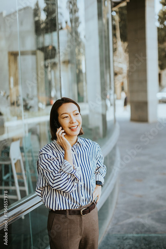 Korean woman talking on the...