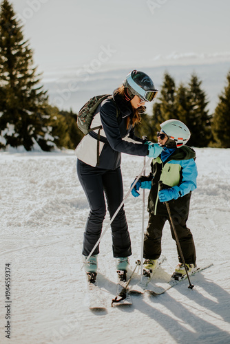 Teaching kids the joy of skiing on a bright winter day in the mountains