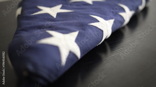 Folded USA Flag Sits On Table