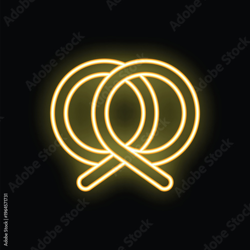 Yellow neon sign in the shape of a delicious looking pretzel, shining brightly against a dark background