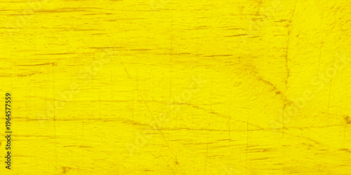 Vivid yellow wood texture with natural grain and distressed aged surface; bright golden timber background for design