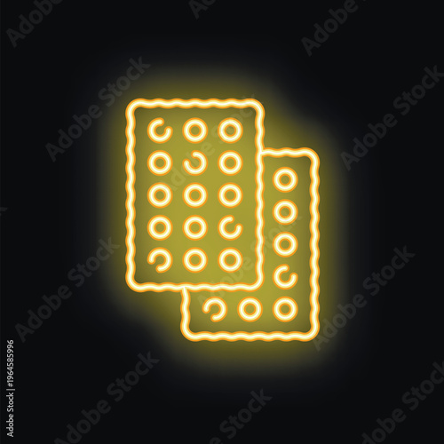 Neon sign of square crackers with holes glowing on black background, concept of bakery, food and sweetness